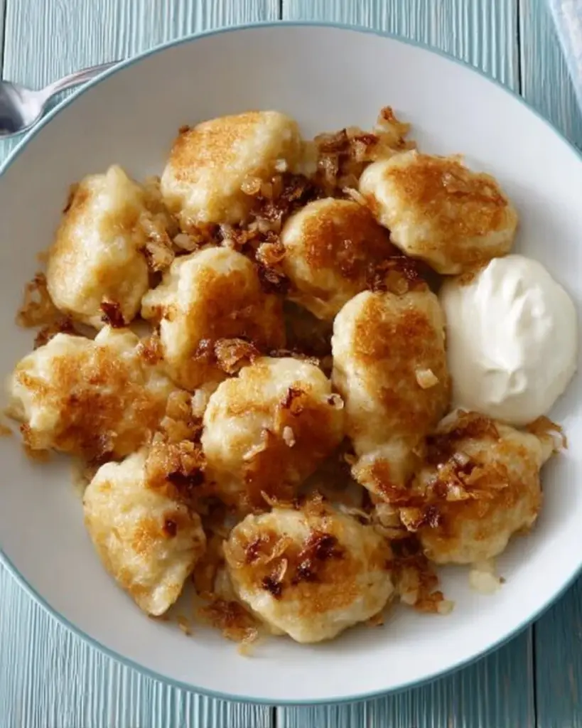 Delicious Galuschki Dumplings served with savory sauce.