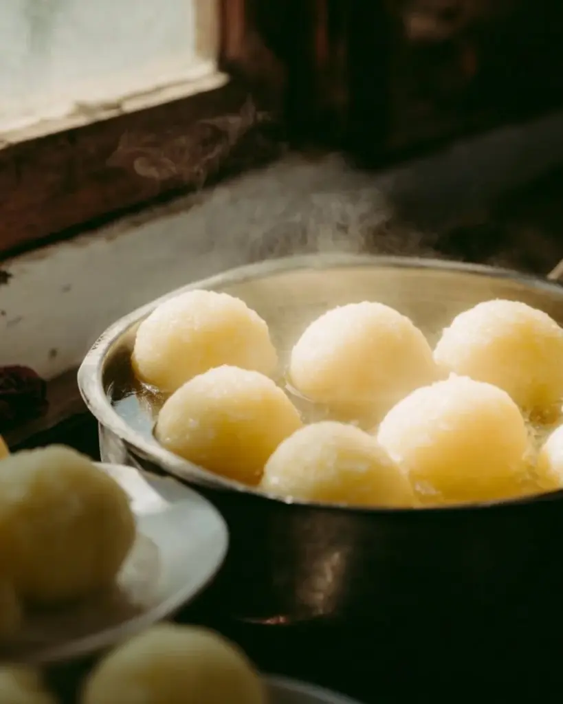 Homemade potato dumplings served on a plate with herbs garnish